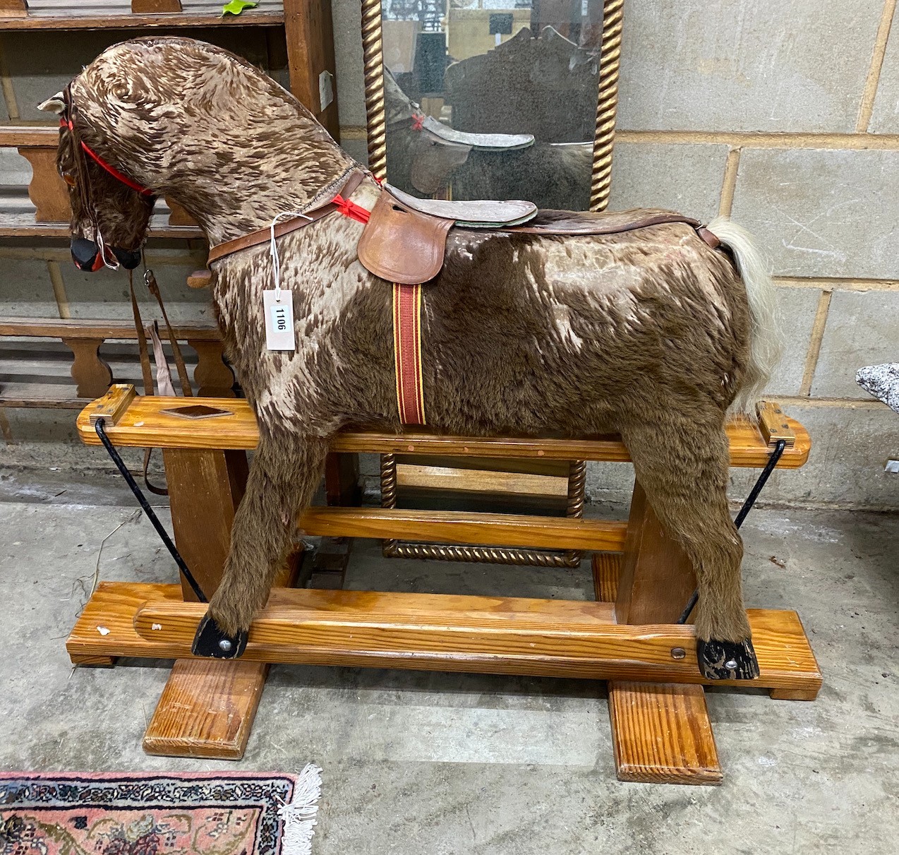 A modern rocking horse on a pine underframe, 112 cm long